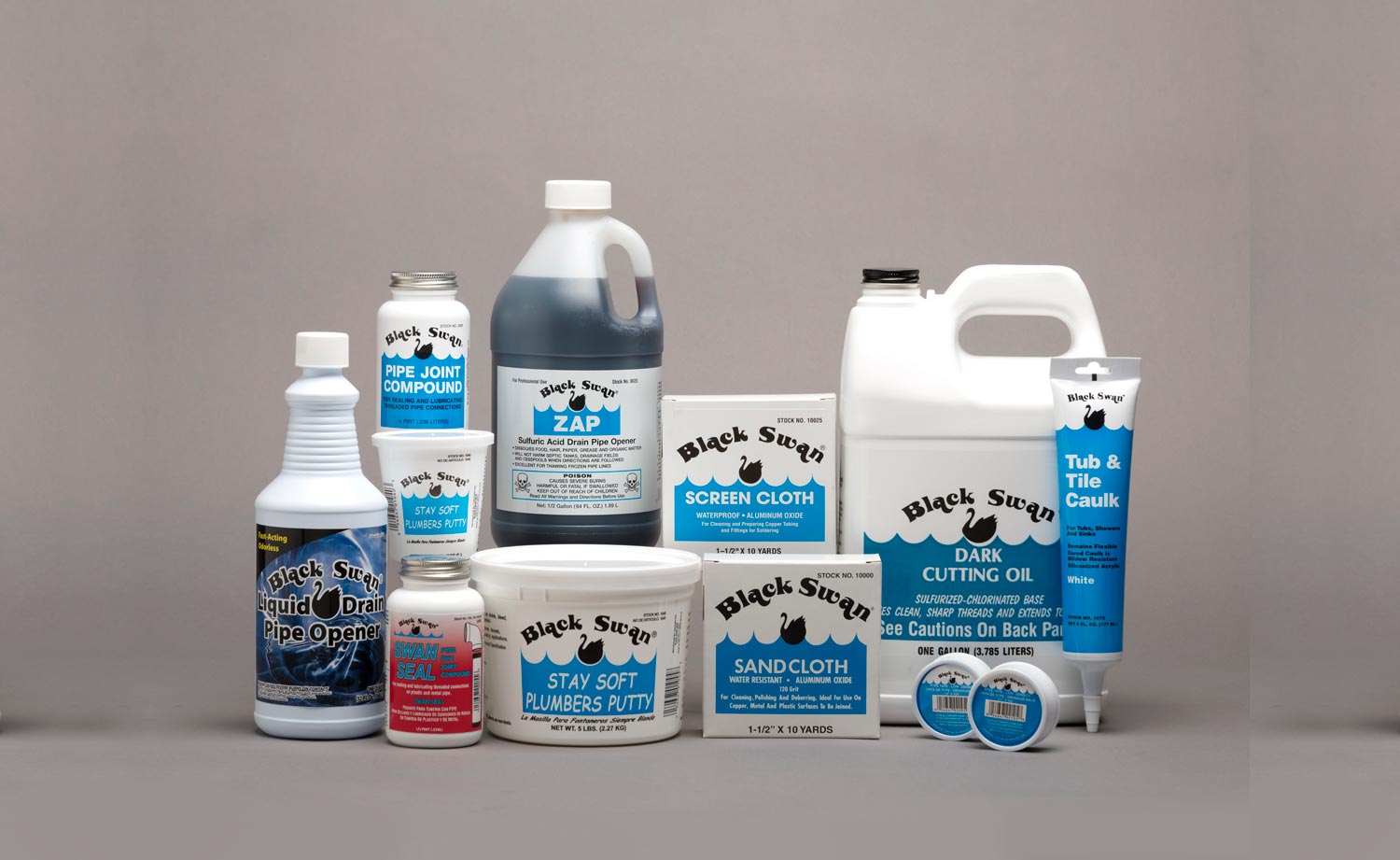 Range of Black Swan adhesive, lubricant, and primer cans displayed together