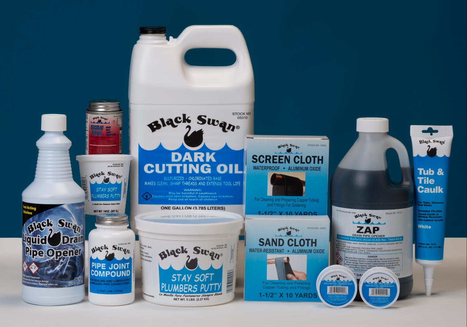 Assorted Black Swan products including pipe cement, primer, and plumber's putty